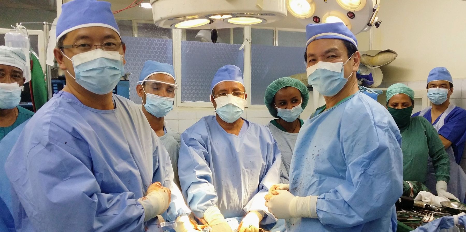An international surgical team and Yordanos Hospital staff gathered in the operating theatre