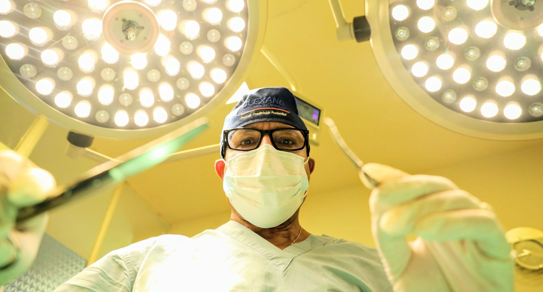 A surgeon operating under the theatre lights at Yordanos Hospital