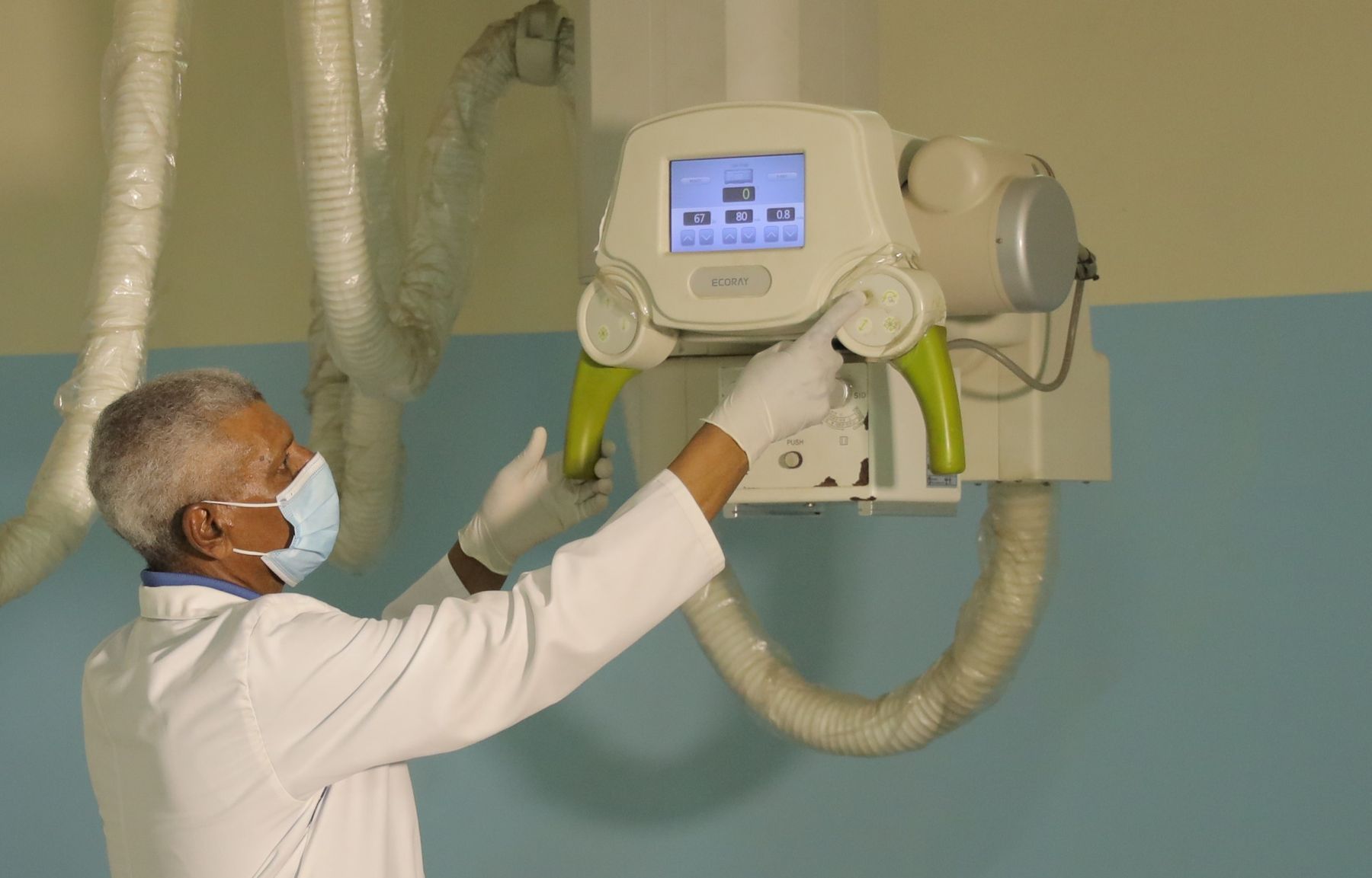 A radiographer positioning the X-ray unit